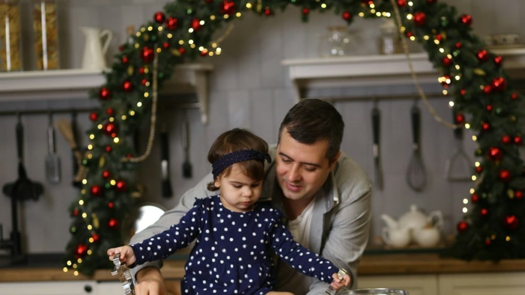 a man and a little girl sitting at a table
